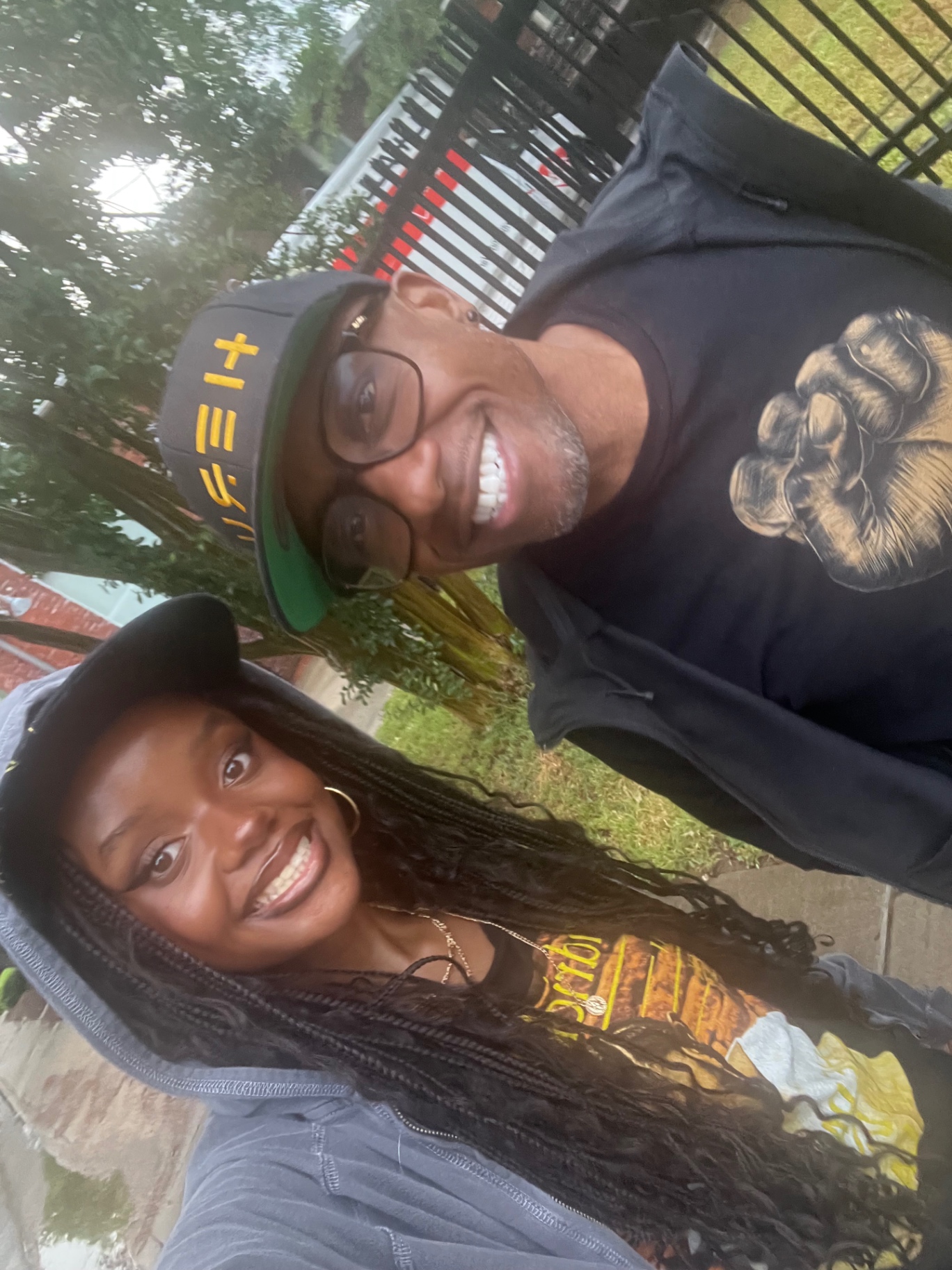 Anabelle Hammons smiling with her father and co-founder Terry Hammons outdoors